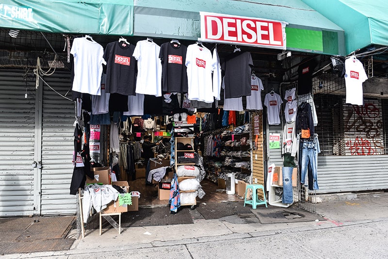 Selling imitation luxury goods on Canal Street, New York City, 2022